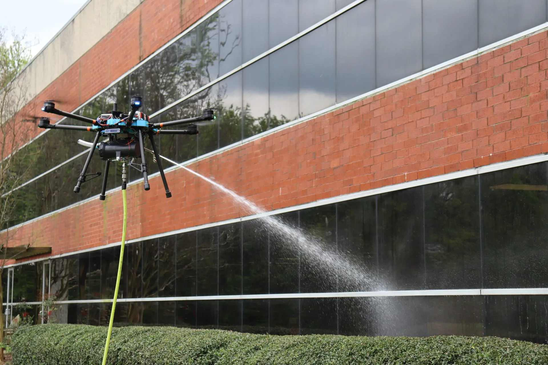 Drone window cleaning for high-rise building